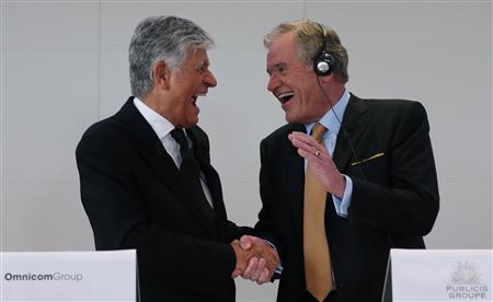 Publicis Chief executive Levy and Omnicom Group head Wren react during a joint news conference in Paris